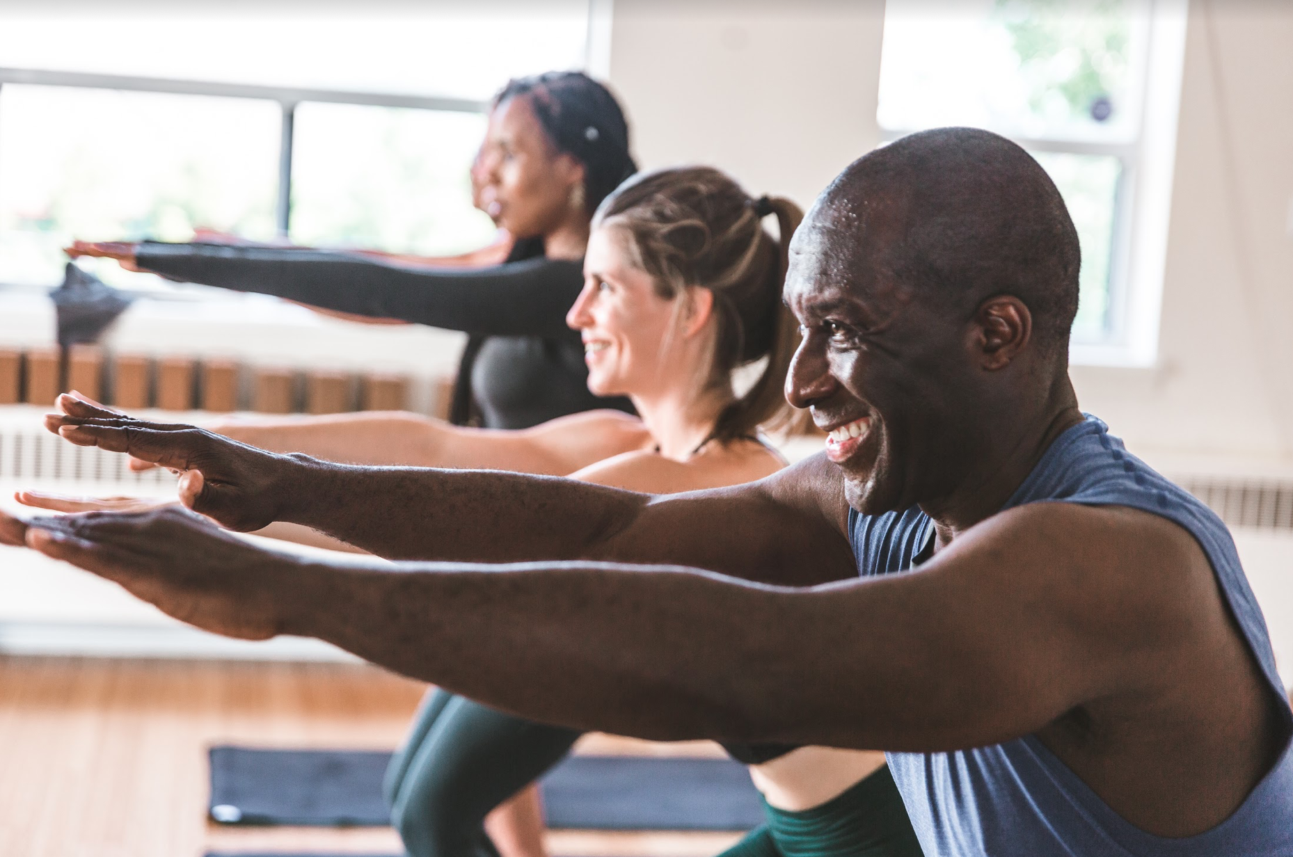 people in a yoga class in powerful pose 1
