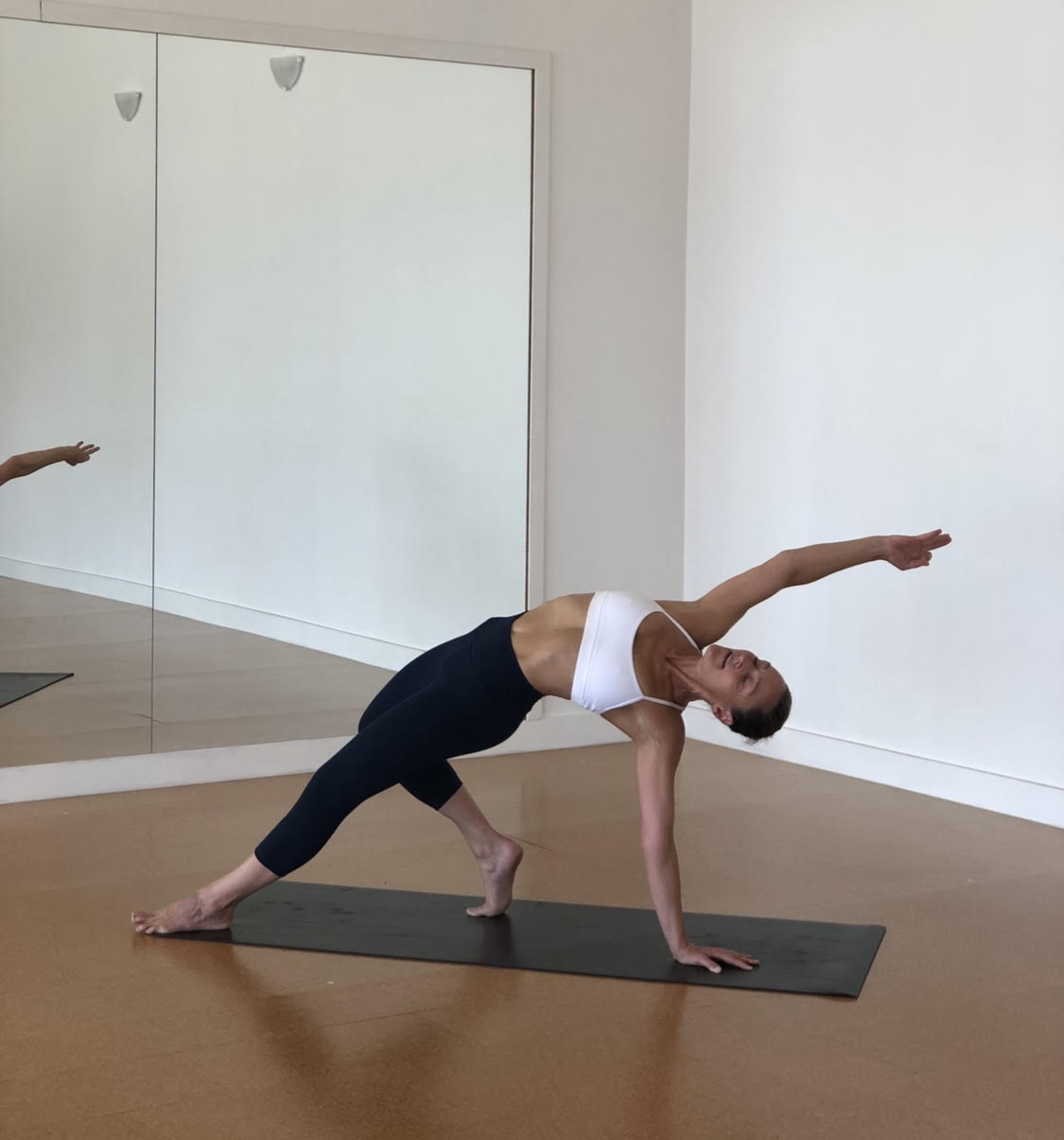 woman practicing yoga and smiling