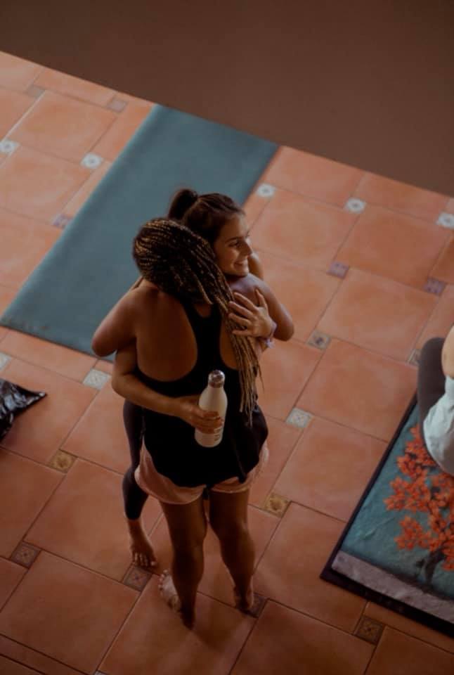 Megan and friend hugging at Modo training.