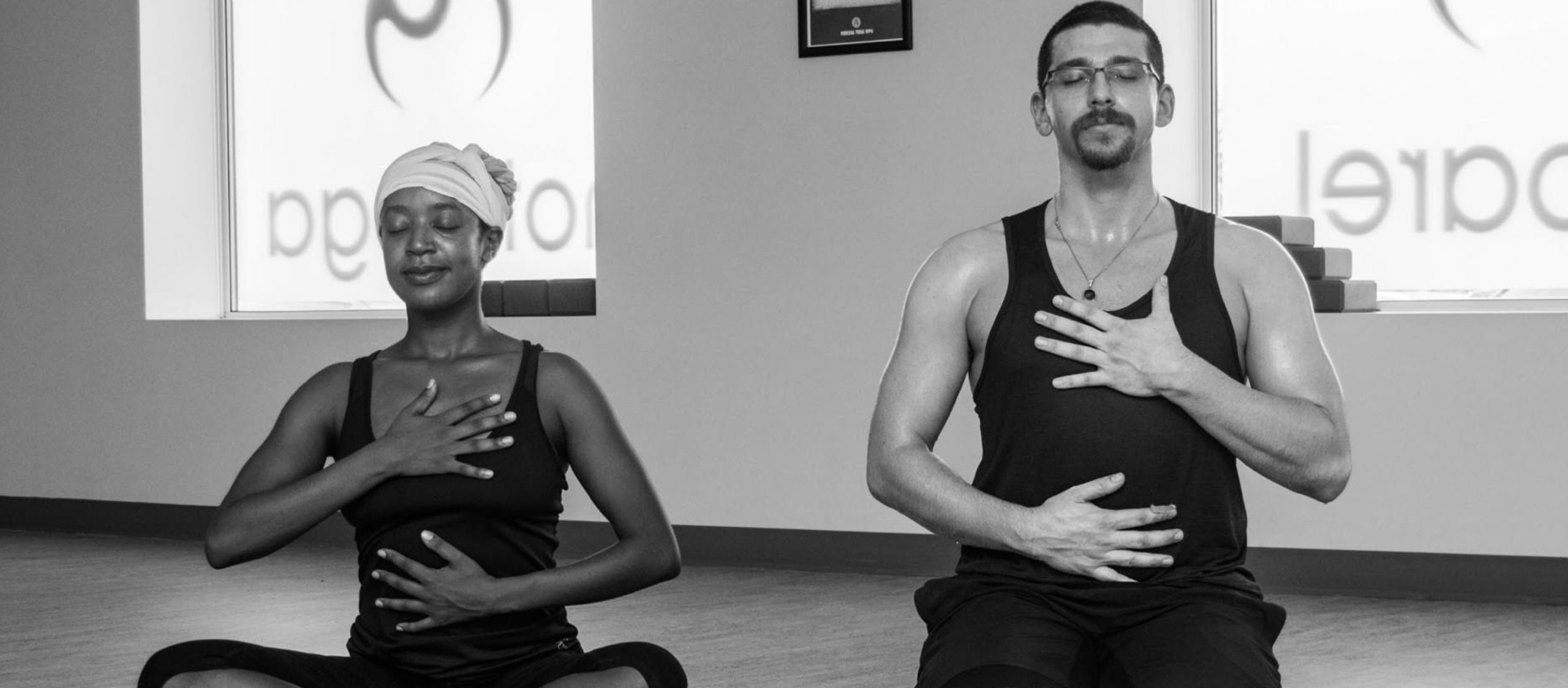 two people with hands on heart
